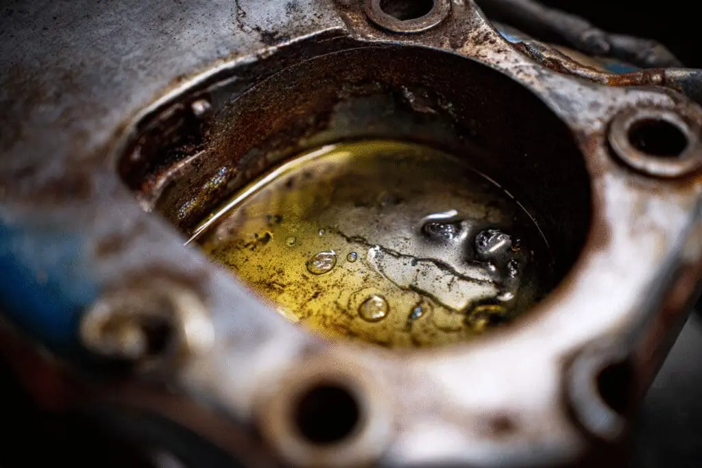 A pro tip for the FAQ on how to get rust out of a gas tank, showing a cleaning solution at work inside the tank
