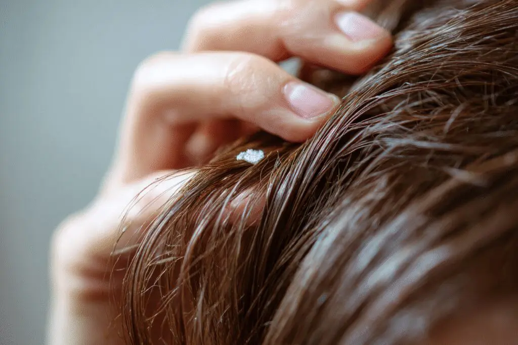 A safe trick for the FAQ on how to get super glue out of hair, using oil to gently dissolve the residue
