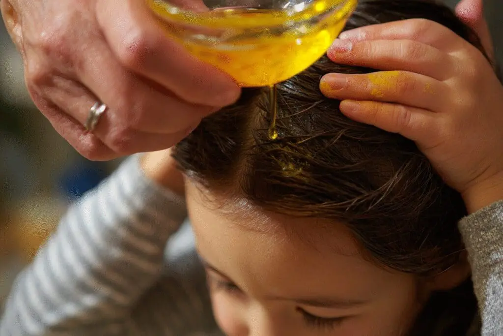 One of the top ways for how to get silly putty out of hair fast, showing a parent using oil to remove it from a child's hair