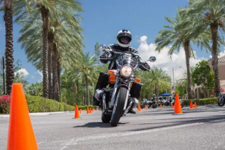 Your guide on how to get a motorcycle license in Florida, showing a rider completing a test course